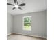 Bedroom featuring a ceiling fan, baseboard trim, and a window offering natural light at 12382 Ritchie Rd, Midland, NC 28107