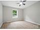 Bright bedroom with new vinyl flooring and a ceiling fan at 12382 Ritchie Rd, Midland, NC 28107