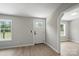 Bright entryway with modern flooring, fresh paint, and natural light at 12382 Ritchie Rd, Midland, NC 28107