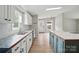 A stylish kitchen featuring white cabinets, granite countertops, and stainless steel appliances at 12382 Ritchie Rd, Midland, NC 28107