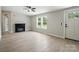 Spacious living room featuring stylish floors, fireplace, and abundant natural light at 12382 Ritchie Rd, Midland, NC 28107