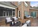 Spacious back deck featuring patio seating, table, and wooded backyard view at 13102 Indigo Run Ct, Charlotte, NC 28278