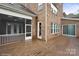 Expansive back deck made of wood with door leading to a screened porch at 13102 Indigo Run Ct, Charlotte, NC 28278