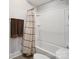 Clean and well-maintained bathroom with a shower-tub combination and a neutral-colored shower curtain and towel set at 13102 Indigo Run Ct, Charlotte, NC 28278