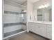 Modern bathroom featuring a spacious glass shower with subway tile and a double vanity at 13102 Indigo Run Ct, Charlotte, NC 28278