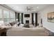 Spacious living room with a fireplace, large windows, and neutral decor at 13102 Indigo Run Ct, Charlotte, NC 28278