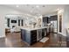 Spacious open floorplan features a modern kitchen, dining area, and cozy living room at 13102 Indigo Run Ct, Charlotte, NC 28278