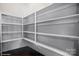Spacious walk-in pantry with ample shelving for organized storage and clean white walls at 13102 Indigo Run Ct, Charlotte, NC 28278