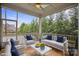 Inviting screened porch with comfortable seating and a view of the lush greenery, perfect for relaxation at 13102 Indigo Run Ct, Charlotte, NC 28278