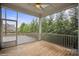 Inviting screened-in porch with wood floors overlooking a green landscape at 13102 Indigo Run Ct, Charlotte, NC 28278