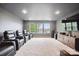 Media room with multiple theater chairs, large tv, and carpeted floors at 13102 Indigo Run Ct, Charlotte, NC 28278