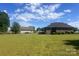 Spacious backyard features a well-manicured lawn and a detached garage with ample space at 1351 Hardin Rd, Dallas, NC 28034