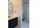 Bathroom vanity with navy blue cabinets and gold hardware next to a glass walk-in shower at 1351 Hardin Rd, Dallas, NC 28034