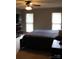 Neutral bedroom with a comfortable bed, a dresser, and natural light from two windows at 1351 Hardin Rd, Dallas, NC 28034