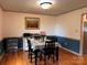 Cozy dining room with hardwood floors and decorative wainscotting at 1351 Hardin Rd, Dallas, NC 28034