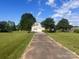 Exterior view of home with large manicured lawn and long driveway at 1351 Hardin Rd, Dallas, NC 28034