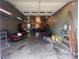 A spacious garage features ample room for storage and hobbies, complete with lighting and convenient access at 1351 Hardin Rd, Dallas, NC 28034
