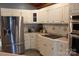 A well-equipped kitchen featuring stainless steel appliances, ample white cabinetry, and cooktop at 1351 Hardin Rd, Dallas, NC 28034