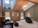 Bright living room with vaulted ceiling, large windows, and neutral decor, perfect for entertaining at 1351 Hardin Rd, Dallas, NC 28034