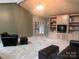 Spacious living room featuring a vaulted ceiling, built-in shelving, and plush carpeting at 1351 Hardin Rd, Dallas, NC 28034
