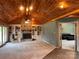 Inviting living room features a brick fireplace, built-in bookcases, and a vaulted wood ceiling at 1351 Hardin Rd, Dallas, NC 28034
