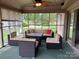 Relaxing sunroom with comfortable outdoor furniture and a view of the backyard at 1351 Hardin Rd, Dallas, NC 28034