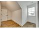 The attic space offers hardwood floors, a window providing natural light, and a door for easy accessibility at 13702 Tranquil Day Dr, Matthews, NC 28105