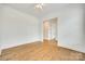 Bright bedroom with hardwood floors and a ceiling fan at 13702 Tranquil Day Dr, Matthews, NC 28105