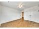 Spacious bedroom featuring hardwood floors, ample natural light, and a large closet for storage at 13702 Tranquil Day Dr, Matthews, NC 28105