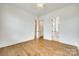 Spacious bedroom with hardwood floors and access to a closet and bathroom at 13702 Tranquil Day Dr, Matthews, NC 28105