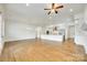 Spacious living room and kitchen with hardwood floors and stainless steel appliances at 13702 Tranquil Day Dr, Matthews, NC 28105