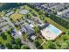 Aerial view of community clubhouse, pool, and tennis courts surrounded by lush landscaping and neighborhood homes at 148 Adelaide Way, Rock Hill, SC 29732