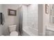 Bathroom with a white tub-shower combo, white toilet, neutral paint and tile floor at 148 Adelaide Way, Rock Hill, SC 29732