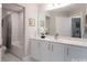 Clean bathroom featuring a white vanity, a shower-tub combo, a large mirror and neutral paint at 148 Adelaide Way, Rock Hill, SC 29732
