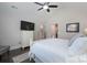 Bedroom with a white bed set, vaulted ceilings, ceiling fan and large dresser at 148 Adelaide Way, Rock Hill, SC 29732