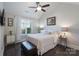 Well-lit bedroom with hardwood floors, a large window, and neutral tones creating a relaxing atmosphere at 148 Adelaide Way, Rock Hill, SC 29732