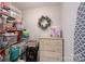 Organized closet with shelving, storage bins, wreath, and a wooden dresser at 148 Adelaide Way, Rock Hill, SC 29732