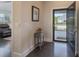Inviting entryway with dark wood floors, stylish table decor, and a view through the open front door at 148 Adelaide Way, Rock Hill, SC 29732