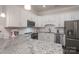 Well-lit kitchen with stainless steel appliances, granite countertops, and white cabinetry for a clean, modern feel at 148 Adelaide Way, Rock Hill, SC 29732