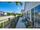 Inviting patio area with comfortable seating, a sun umbrella, and lush landscaping at 148 Adelaide Way, Rock Hill, SC 29732