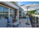 Relaxing patio with Adirondack chairs, a sun umbrella, and a charming water feature at 148 Adelaide Way, Rock Hill, SC 29732