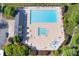 Aerial shot of a community pool with ample lounge seating, splash pad and a nearby recreation area at 148 Adelaide Way, Rock Hill, SC 29732