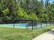 Well maintained tennis court with a bench for resting between sets on a beautiful day at 148 Adelaide Way, Rock Hill, SC 29732