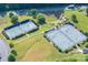 Aerial view of well-maintained community tennis courts surrounded by manicured landscaping and greenery at 148 Adelaide Way, Rock Hill, SC 29732