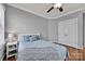 Bedroom with hardwood floors, neutral walls, and white trim at 15430 Waterfront Dr, Huntersville, NC 28078