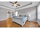 Spacious bedroom with trey ceilings and hardwood floors features a bright white bedroom suite at 15430 Waterfront Dr, Huntersville, NC 28078