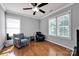 Bedroom with hardwood floors, natural light, and seating at 15430 Waterfront Dr, Huntersville, NC 28078
