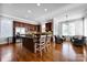 Bright eat-in kitchen with stainless appliances, dark wood cabinets, an island, and seating at 15430 Waterfront Dr, Huntersville, NC 28078