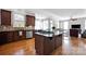 Spacious kitchen with stainless appliances, dark wood cabinets, and eat-in area at 15430 Waterfront Dr, Huntersville, NC 28078