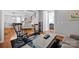 Comfortable room with hardwood floors, staircase, and neutral paint at 15430 Waterfront Dr, Huntersville, NC 28078